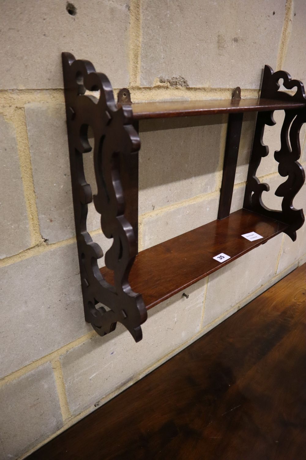 A Victorian mahogany two tier wall bracket, width 52cm depth 17cm height 46cm